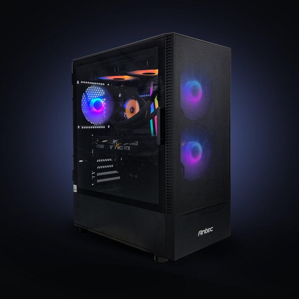 Black mesh-front gaming PC with green and blue RGB fans, an earlier Evolve Bronze build